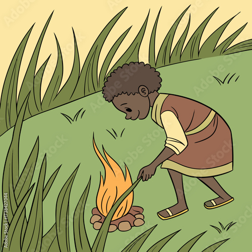 A young boy with dark skin and curly hair carefully tends to a small campfire in a grassy field