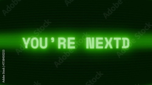 Old green CRT screen showing text YOU’RE NEXT! appearing in random glitch and coding style