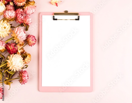 Pastel pink clipboard with dried flowers