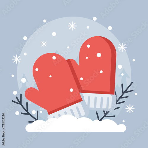 Red mittens sitting in snow with branches in winter landscape  