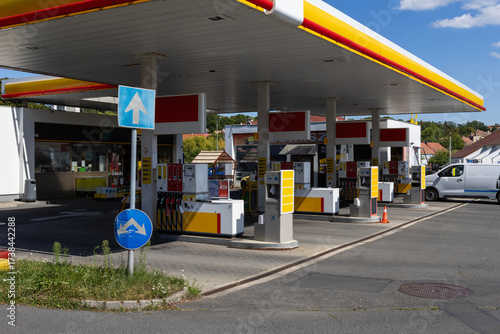 Modern gas station with fuel pumps and convenience store

