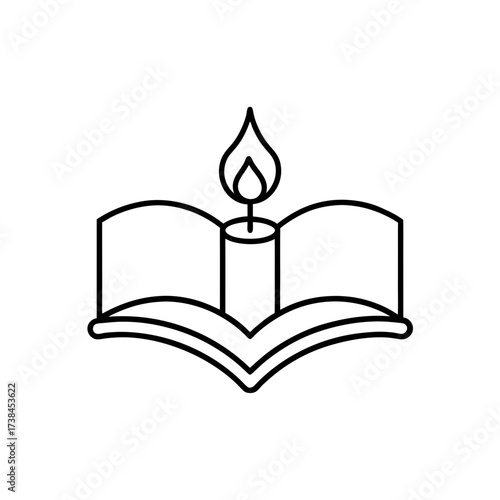 Candle on top of an open book