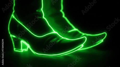 Neon Witch Shoes Outline Glowing - This video shows a pair of witch shoes outlined with vibrant green neon light against a black background.