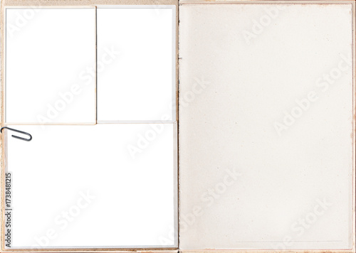 A vintage book pages with blank photo frames attached with paper clips.