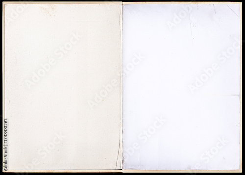 Antique book unfolded showing textured pages.