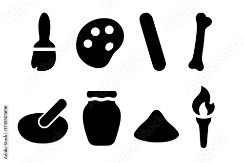 Cave Art Tools. Solid, filled icon set of cave painting tools: paintbrush, stone palette, charcoal stick, bone tool, grinding stone, animal fat jar, pigment