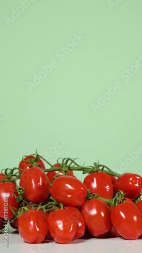 Small fresh tomatoes, slowly rotation