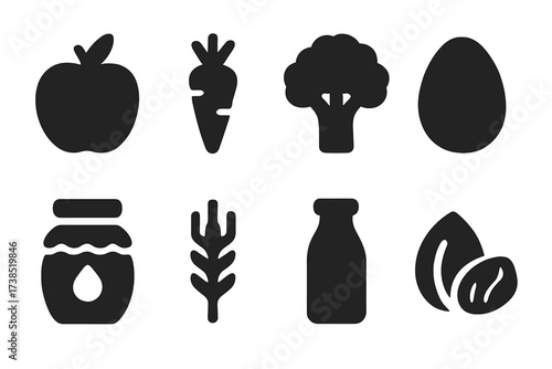 Organic Food Icons. Solid, filled icon set of organic food: apple, carrot, broccoli, egg, honey jar, wheat stalk, milk bottle, nuts. Solid, filled icons in