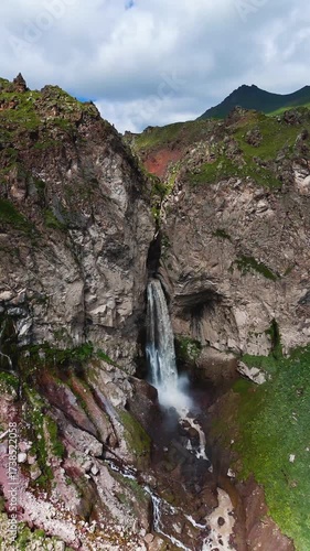 Flying over the Jily-Su Waterfall in the Caucasus in the summer