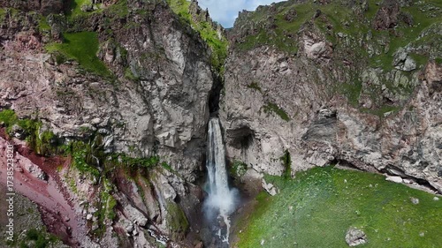 Flying over the Jily-Su Waterfall in the Caucasus in the summer