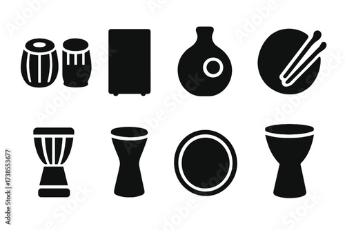 Percussion Instrument Icons. Solid, filled icon set of percussion cultural instruments: tabla, cajon, udu, bodhran, talking drum, bata drum, frame drum,