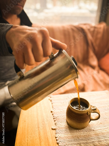 hand pouring coffee - breakfast, calm, morning routine