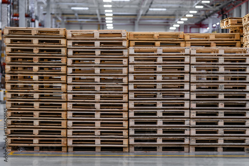 Eco Transport Solutions with Reusable Wooden Pallets in Warehouse