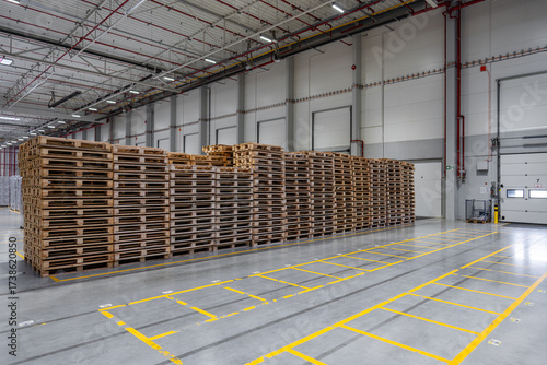 Eco Transport Solutions with Reusable Wooden Pallets in Warehouse