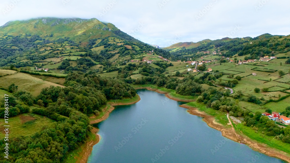 Fototapeta premium Rural landscape with lake hills and mountain slopes for outdoor leisure