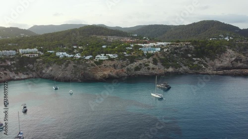 Sailboats anchored in turquoise bay Ibiza.