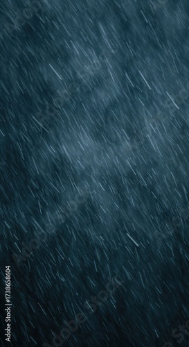 Numerous bright white streaks of precipitation fall diagonally against a dark teal and navy blue atmospheric background, creating a dynamic abstract pattern.