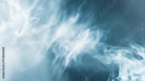 Abstract swirls of light and shadow create a cloudy, ethereal atmosphere