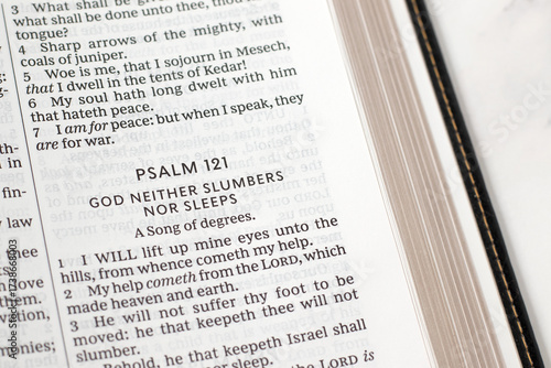 Psalm 121 for God's help, care and protection in open holy bible book. Christian biblical concept.