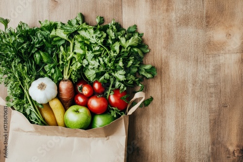 Fresh vegetables and fruits in paper grocery bag