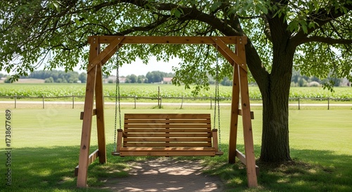 empty swing in the park,ayunan kayu dibawah pohon yang rindang 