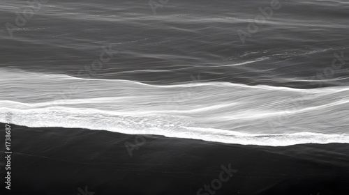 Fototapeta Naklejka Na Ścianę i Meble -  Monochrome ocean wave pattern from above, black and white sea water