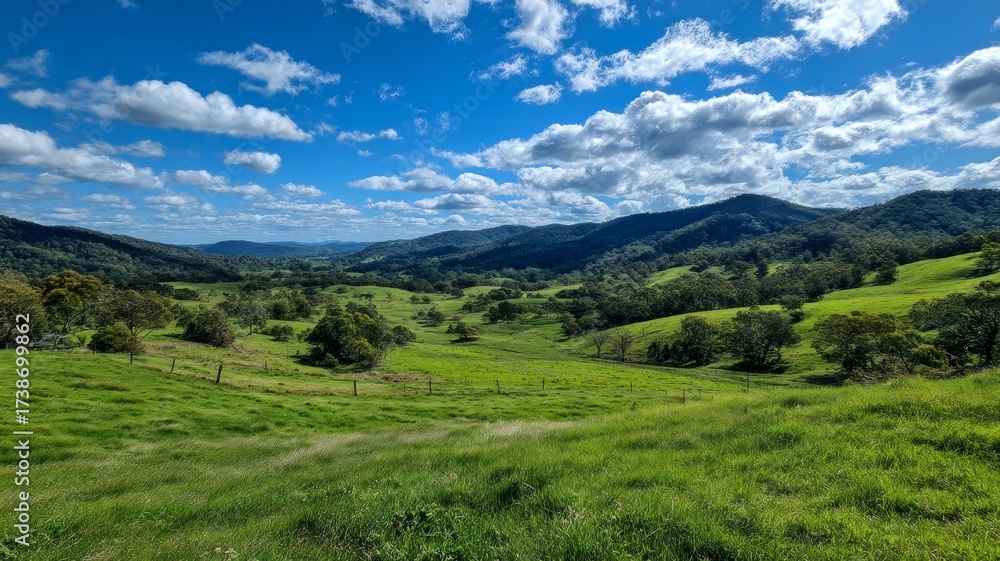 Fototapeta premium Rolling hills with blue sky and mountains. AI image