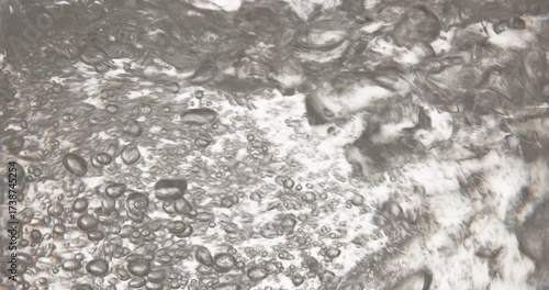 hot boiling water in electric teapot, food and drink closeup, close-up of boiling, bubbling water inside a transparent glass electric kettle. Hot steam and bubbles