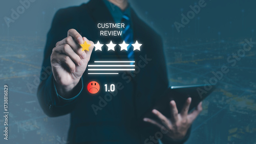 Businessman hand holding digital star rating with low customer review feedback score 1.0, unhappy client experience, poor service evaluation, online reputation and consumer dissatisfaction.