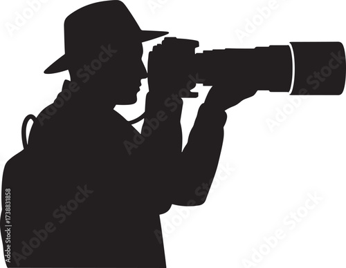 Silhouette of a photographer with a large telephoto lens capturing a moment.