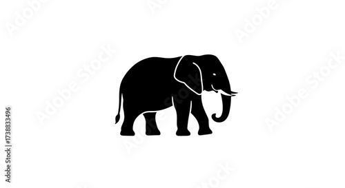 Silhouette of an elephant standing against a white background, showcasing its distinctive shape and features.