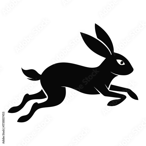 Silhouette of a black rabbit in mid leap with long ears and short tail on a white background art