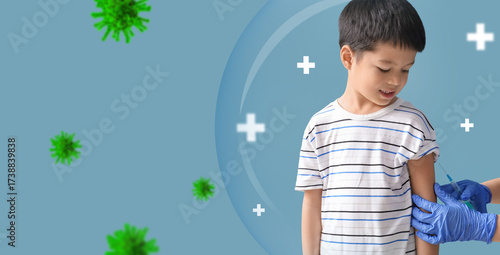 Little Asian boy receiving ...