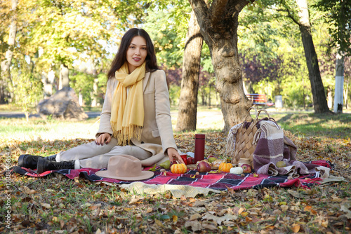 Young happy Asian woman wit...