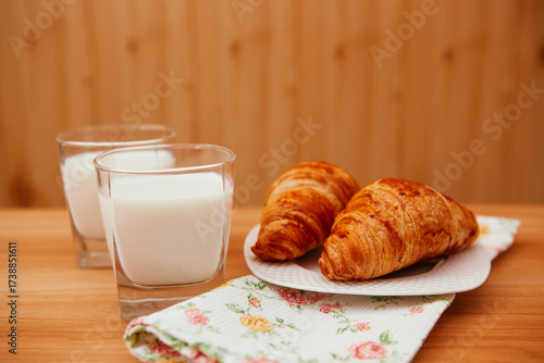Croissants and milk on the table as a delicious breakfast  