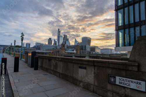 London skyline at sunrise viewed from Southwark Bridge