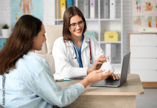 Happy young female doctor w...