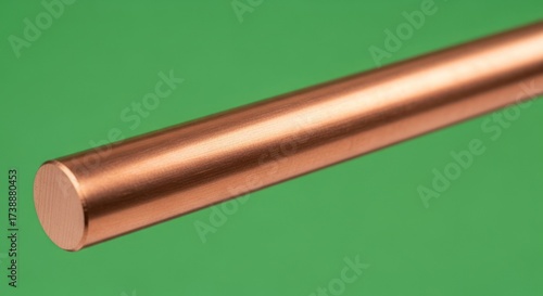 Shiny Copper Rod on Green Background Close-up