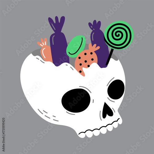Skull filled with Halloween candy and a lollipop