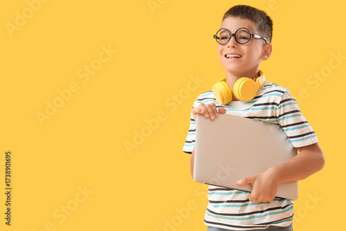 Little boy in eyeglasses wi...