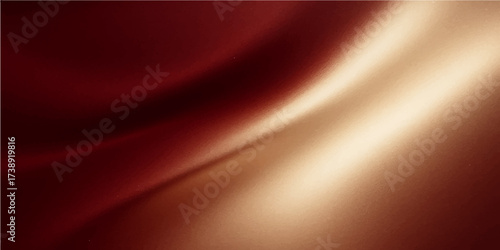 Soft, flowing red silk fabric with golden stripes creates an abstract wave pattern on a smooth satin textile backdrop