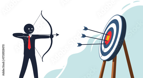 A determined businessman aims his bow and arrow at a target with three arrows already in the bullseye.