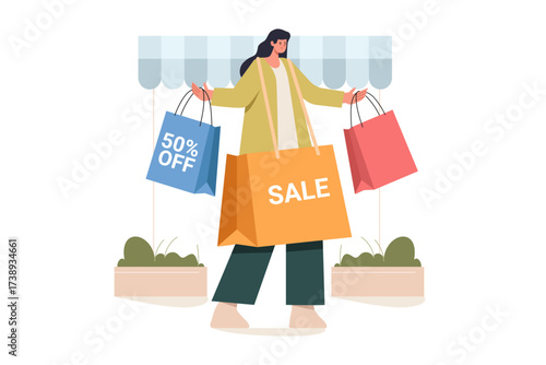 Woman carrying shopping bags with 50 OFF and SALE