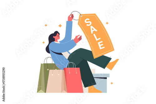 Woman holding a SALE tag sits among shopping bags