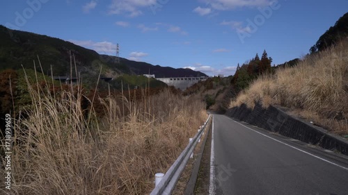 At the end of the road, you can see the Hokuzan Dam — a concrete gravity dam nestled in the mountains in Saga prefecture, JAPAN. without sounds