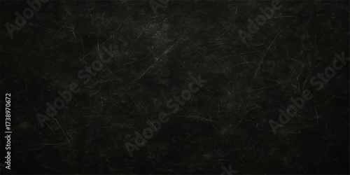 Grunge textured black and white smoke pattern on a dark vintage rough paper background