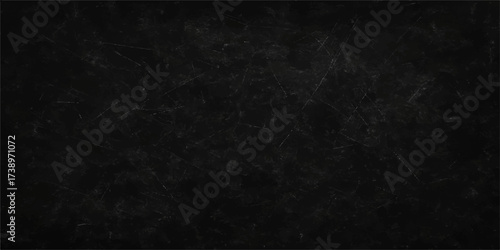 Old grunge black chalkboard texture with white chalk marks and a dark vintage paper backdrop
