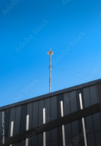 metal lightning rod pole on the building roof.