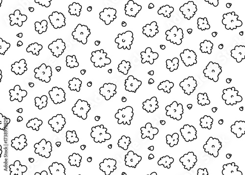 A black and white illustration featuring a scattered pattern of stylized floral elements.