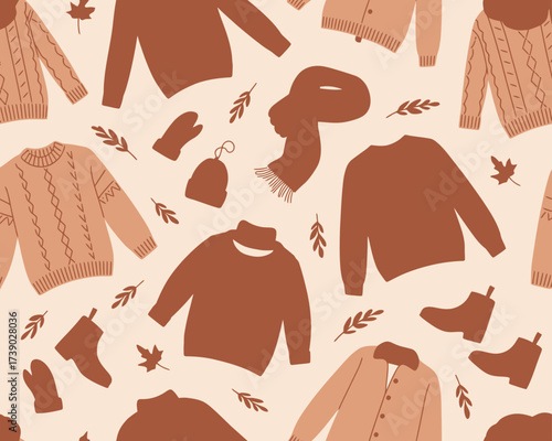 Cozy autumn clothing pattern with sweaters scarves and mittens